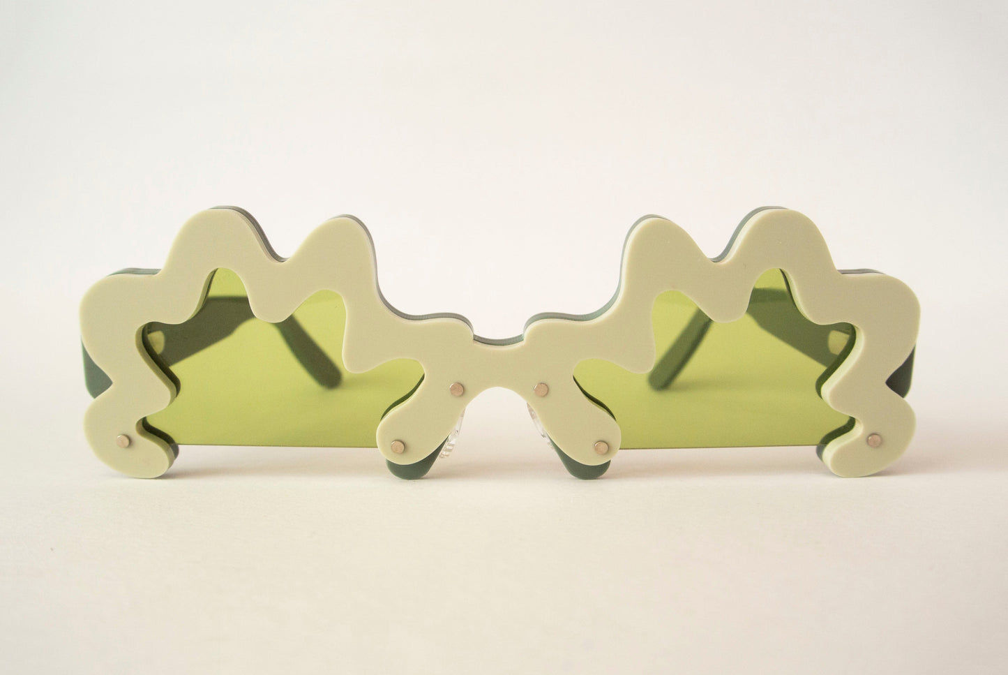 wavy green glasses with green lenses