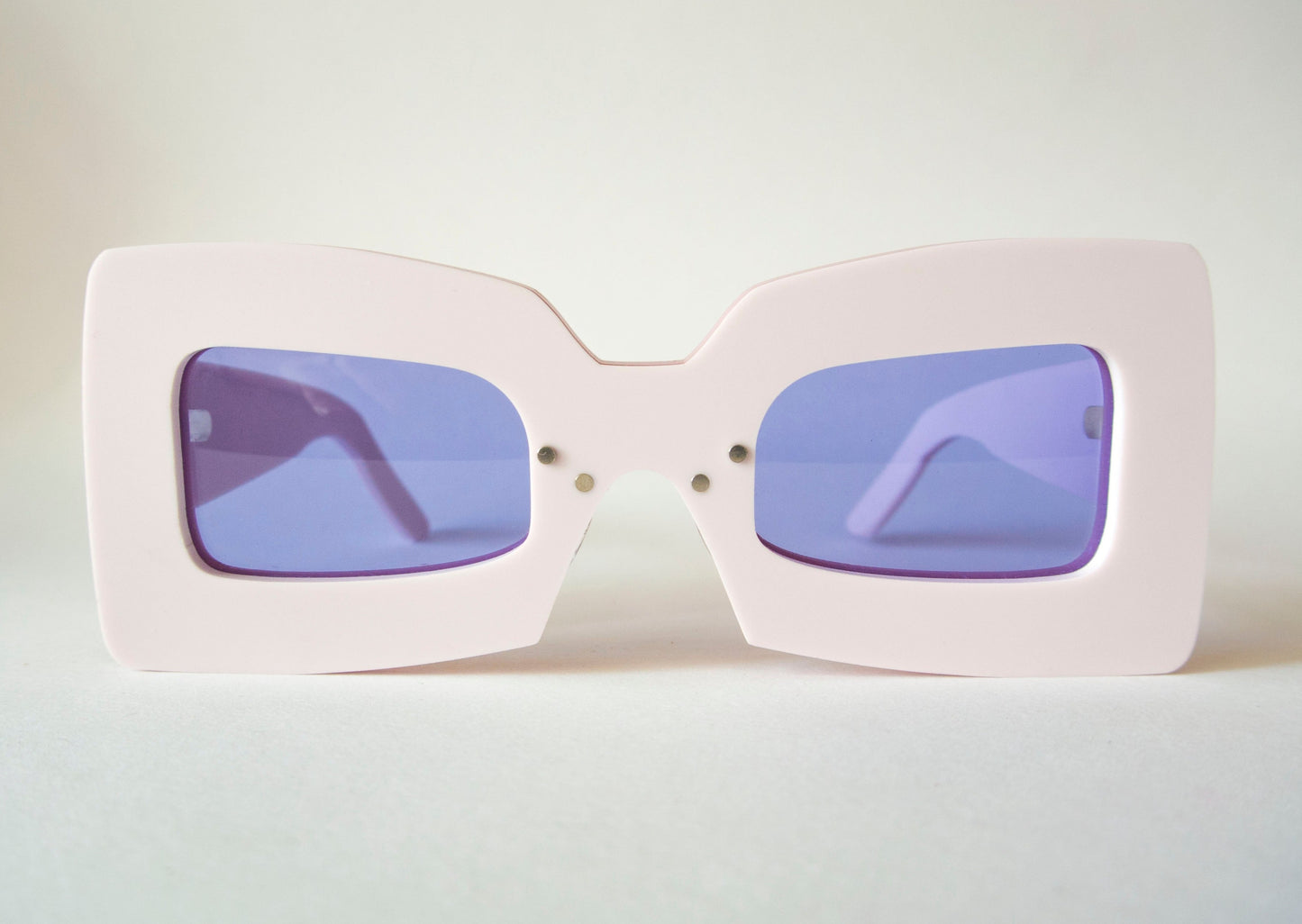 marshmallow pink square shaped glasses with violet lenses