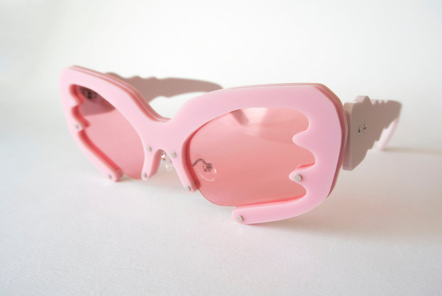 pink framed y2k style glasses with pink lenses
