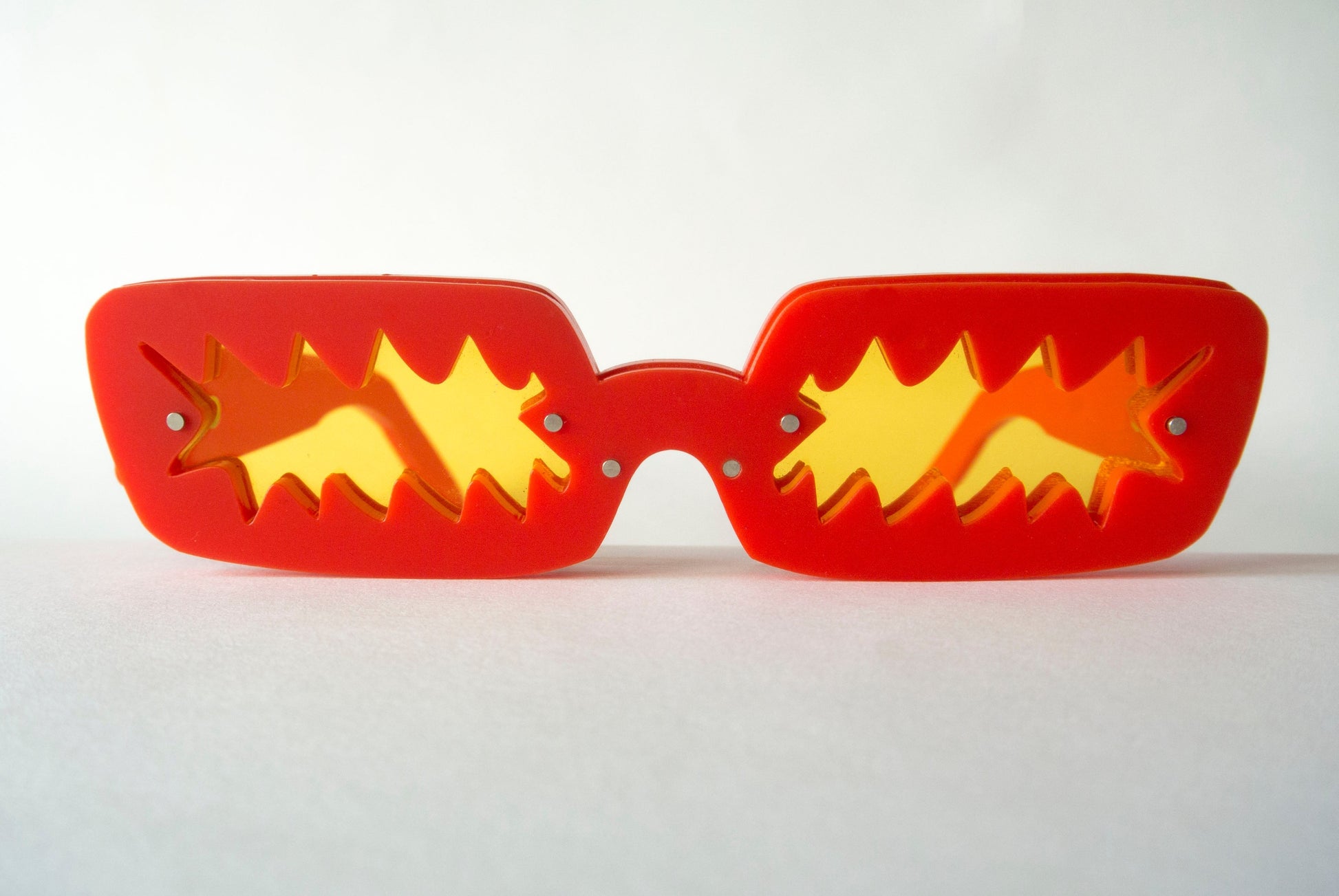 Red sunglasses with yellow lenses by Animalhair