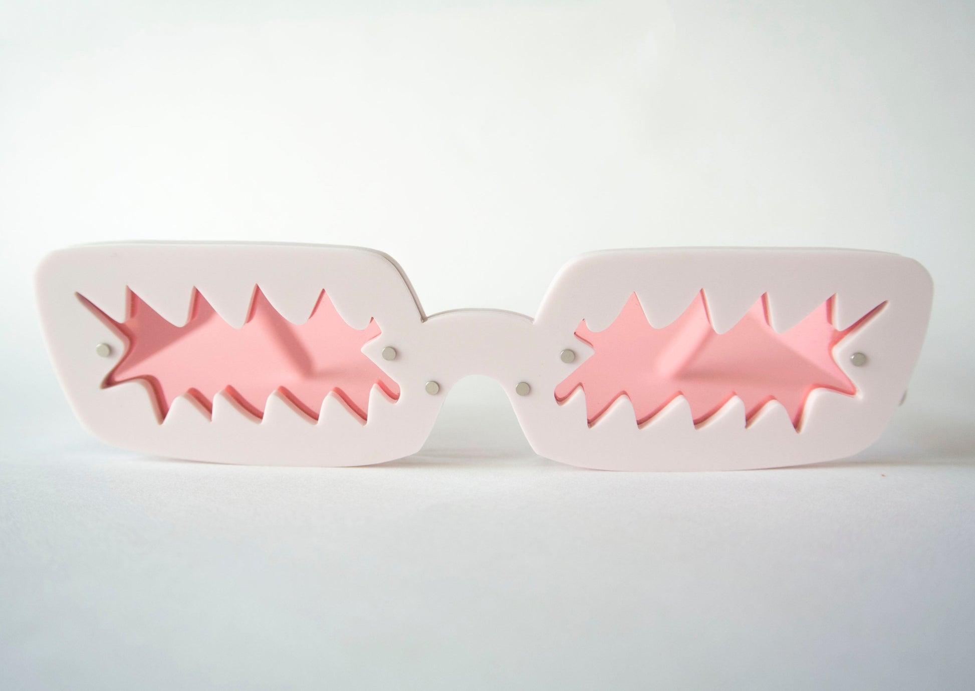 pink lense matte glasses with funky shaped lenses