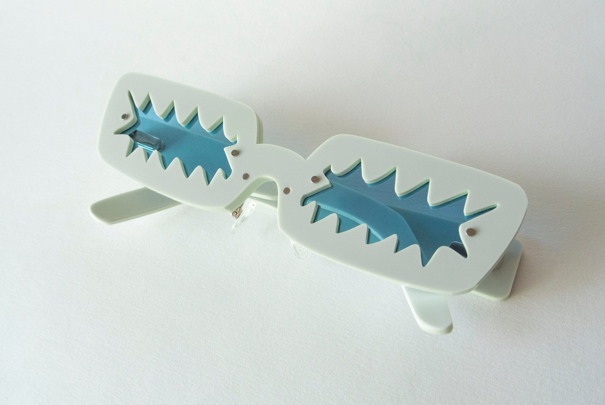 Blue glasses with zigzag shaped blue lenses