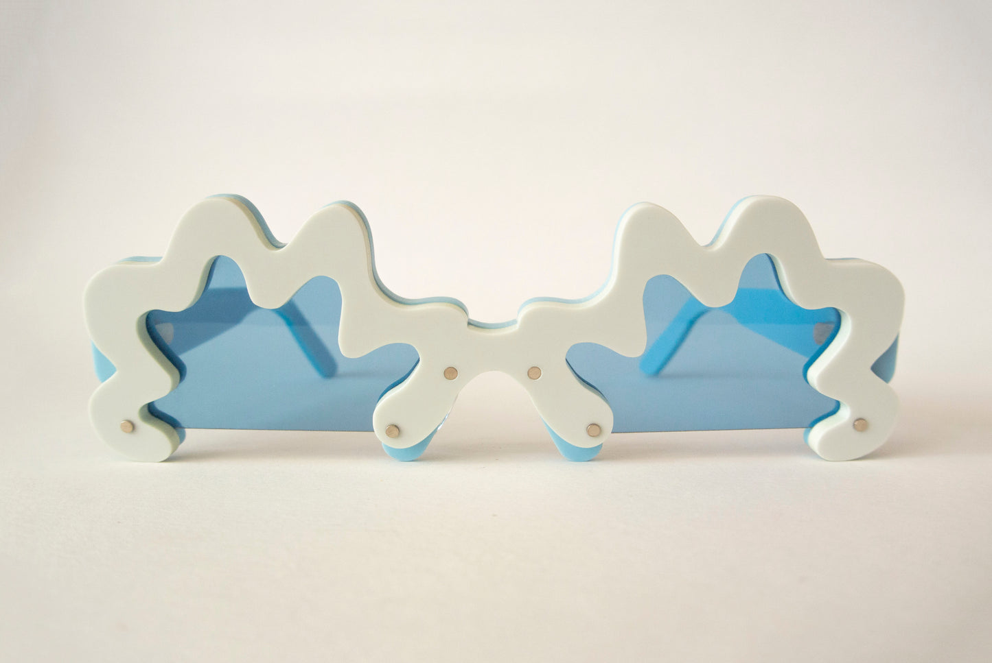 blue rim glasses with blue lenses in an irregular shape