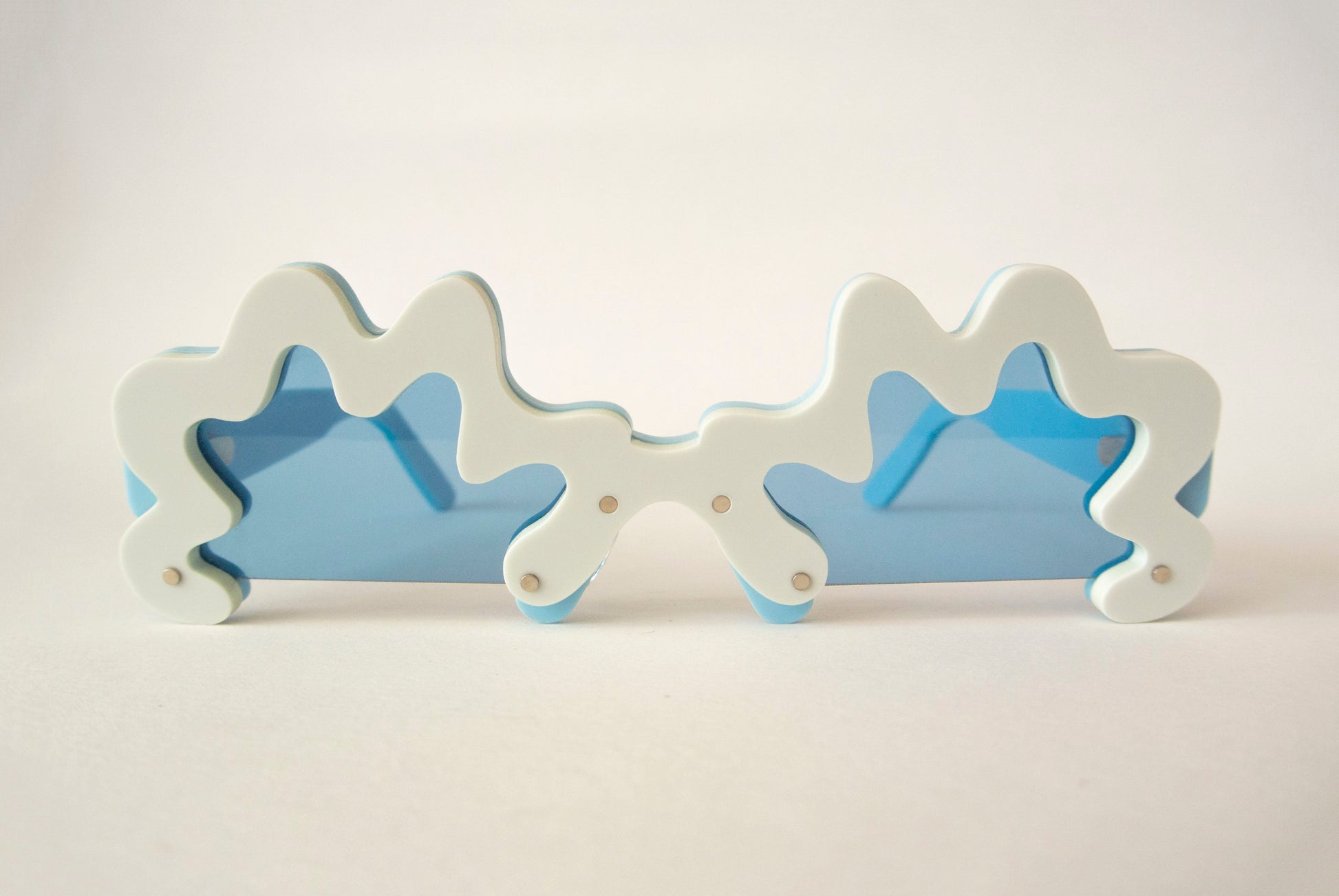 blue rim glasses with blue lenses in an irregular shape