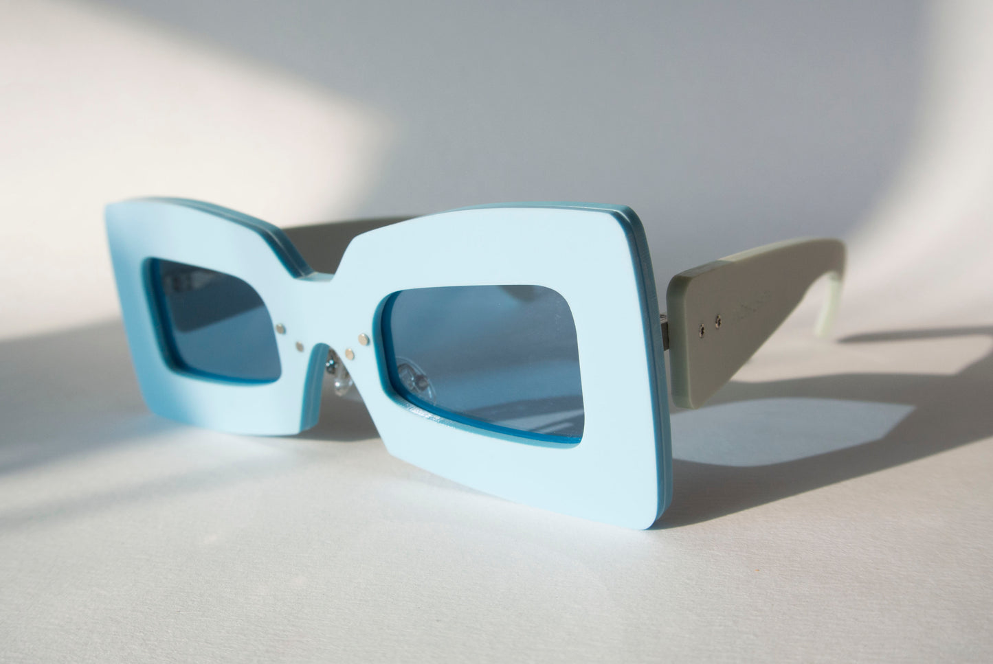 light blue sunglasses with two tone blue effect