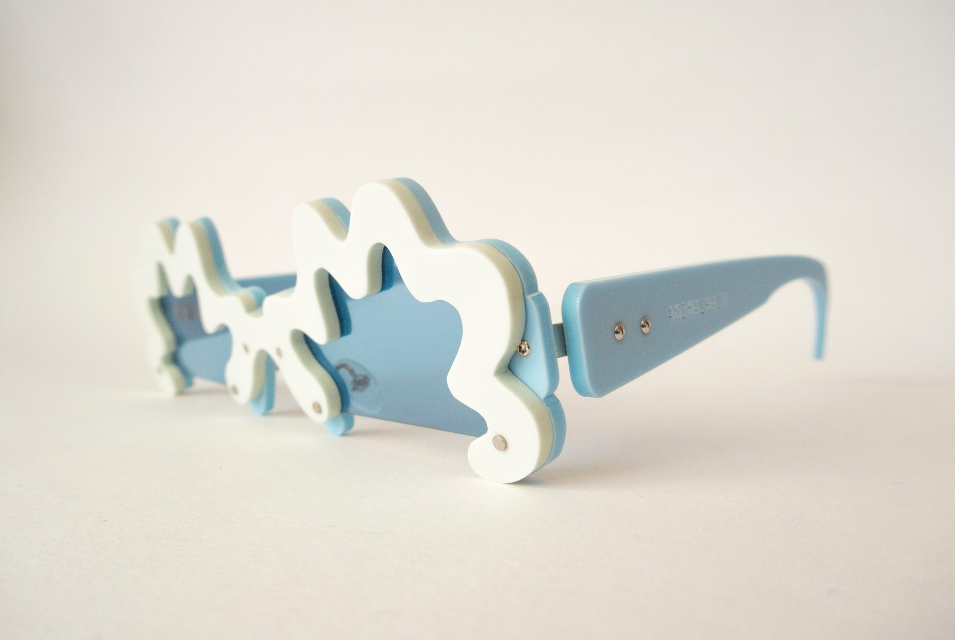 wriggly line sunglasses with blue lenses 
