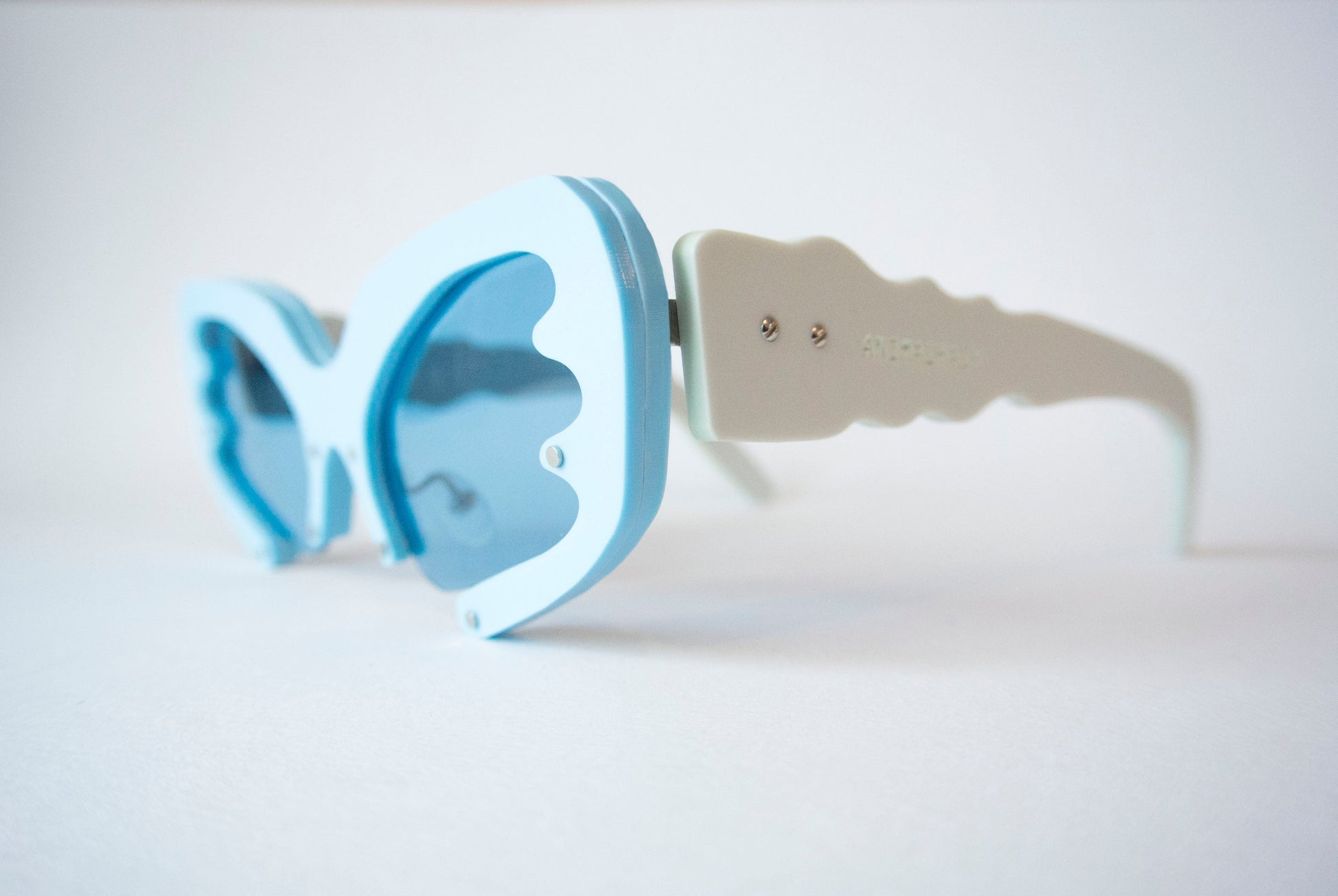 Blue sunglasses with light blue irregular shaped temples