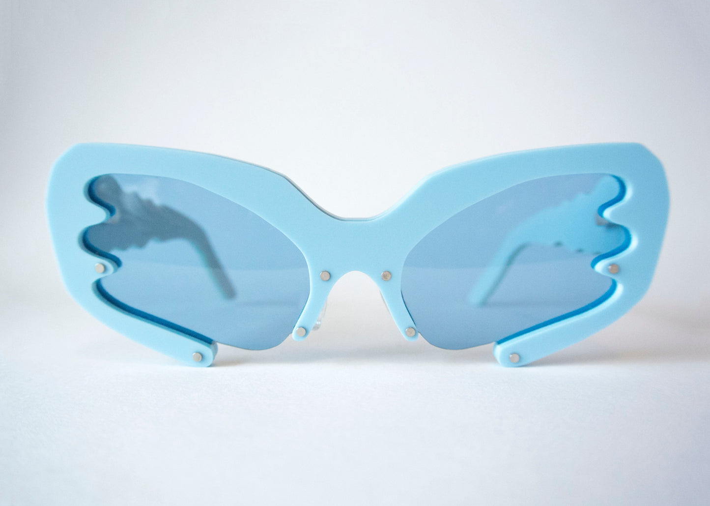 Blue Y2K style sunglasses with blue lenses