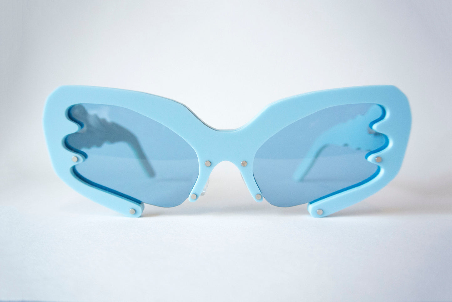 Blue Y2K style sunglasses with blue lenses