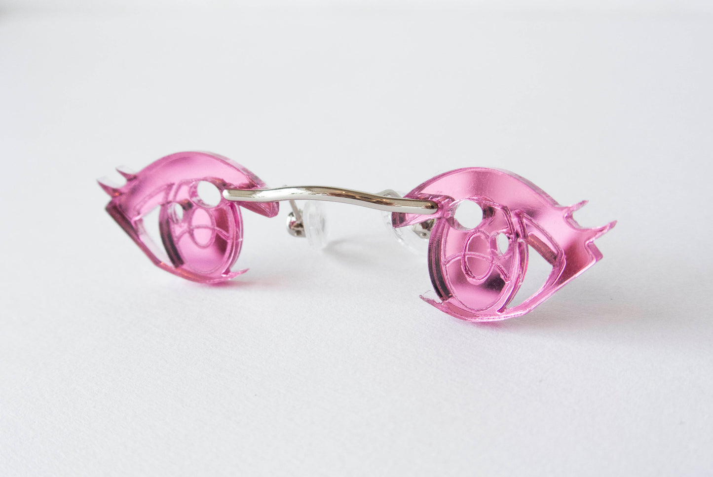 Miniature glasses for your nose in the shape of pink anime eyes