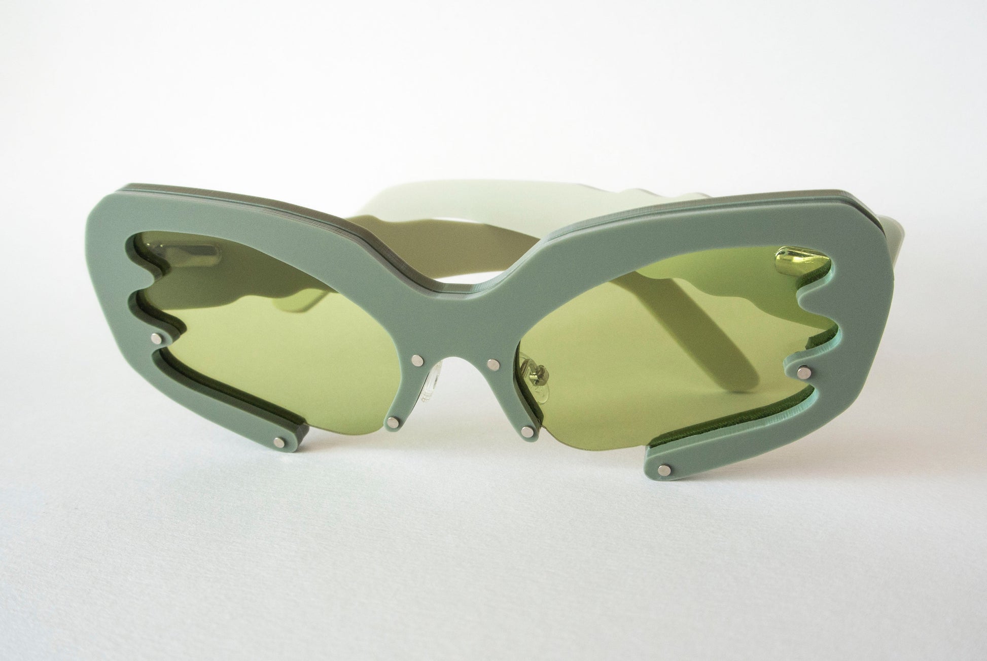 green sunglasses with green lenses by liverpool designer anna mulhearn