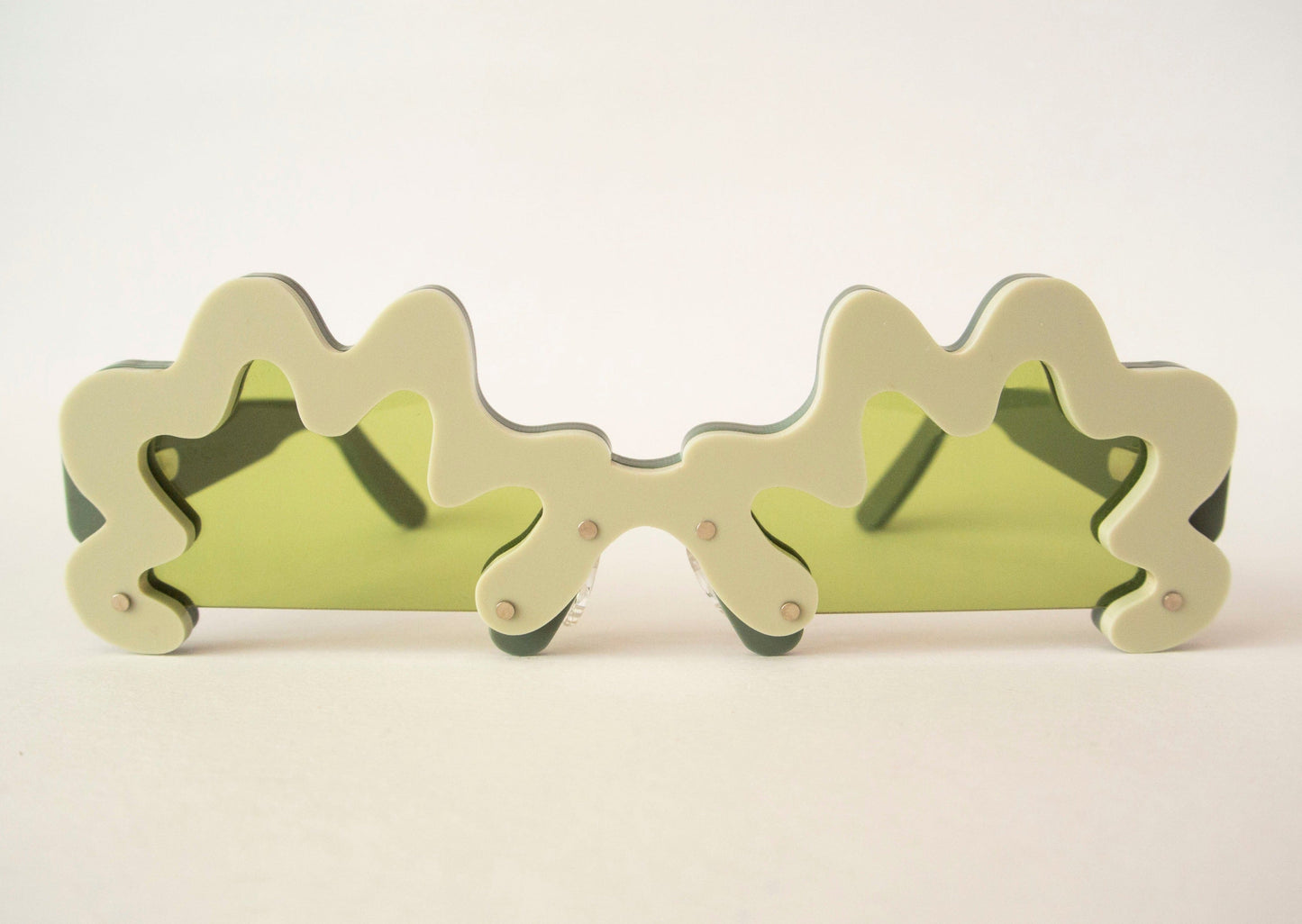 wavy green glasses with green lenses