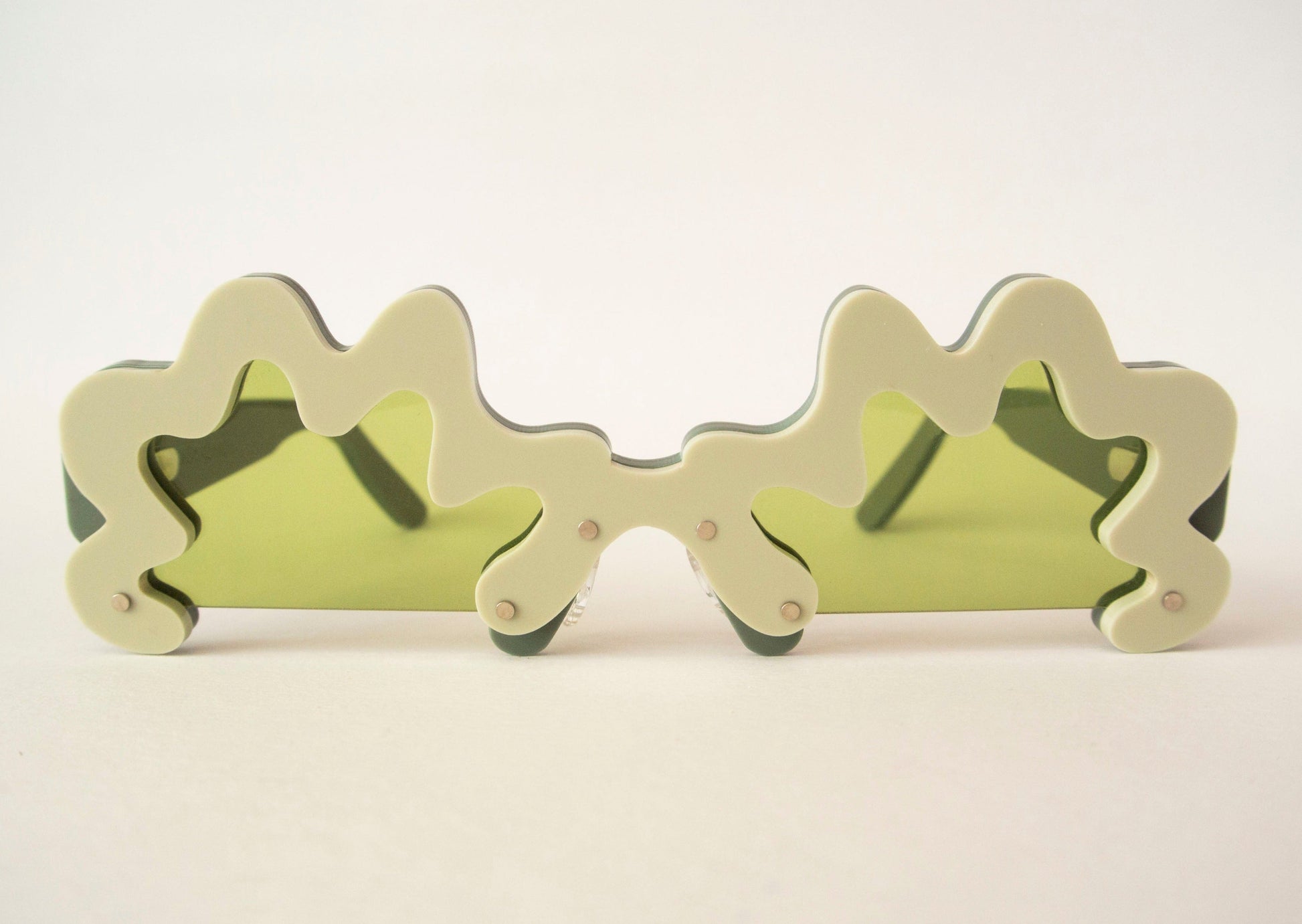 wavy green glasses with green lenses