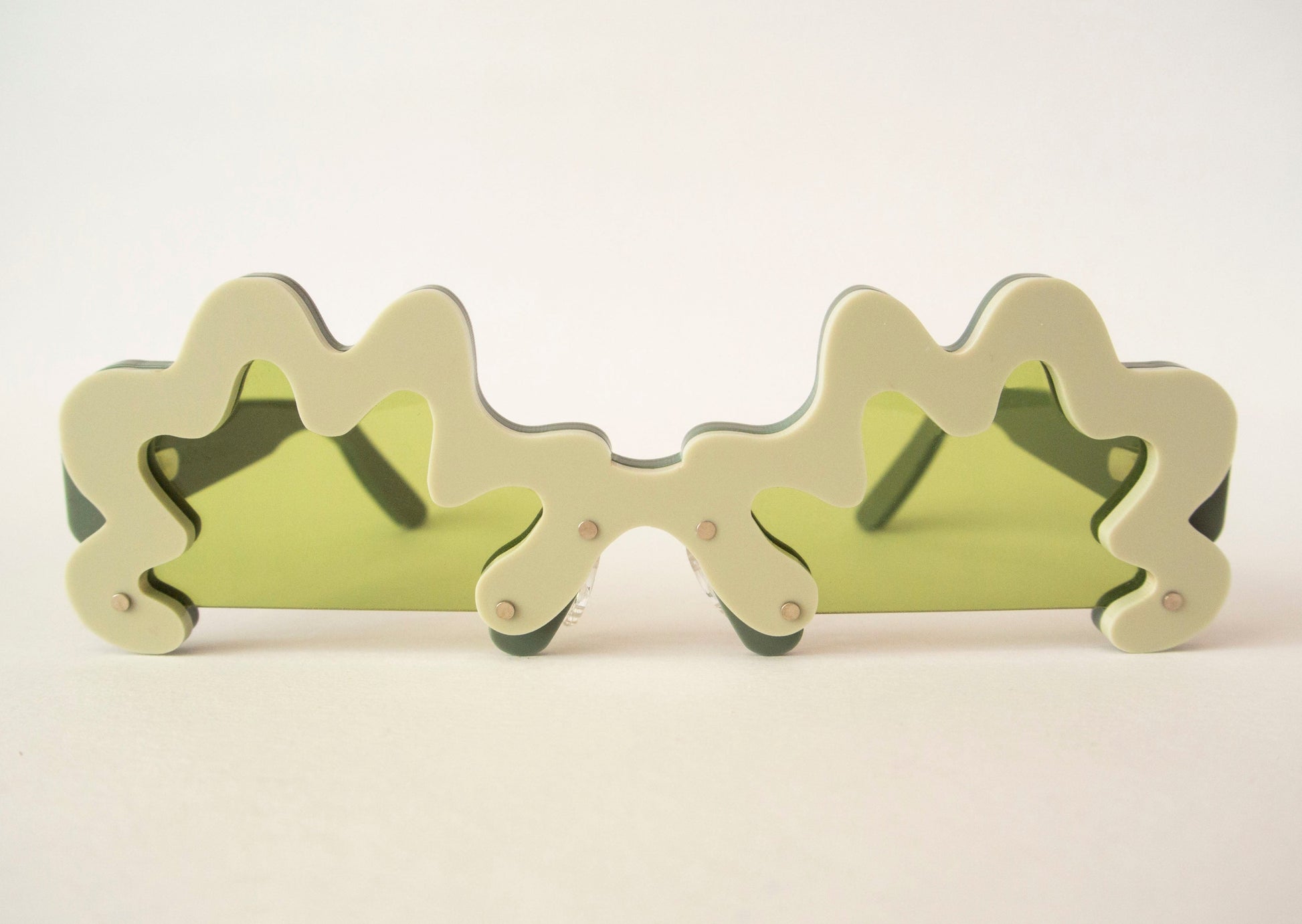 wavy green glasses with green lenses