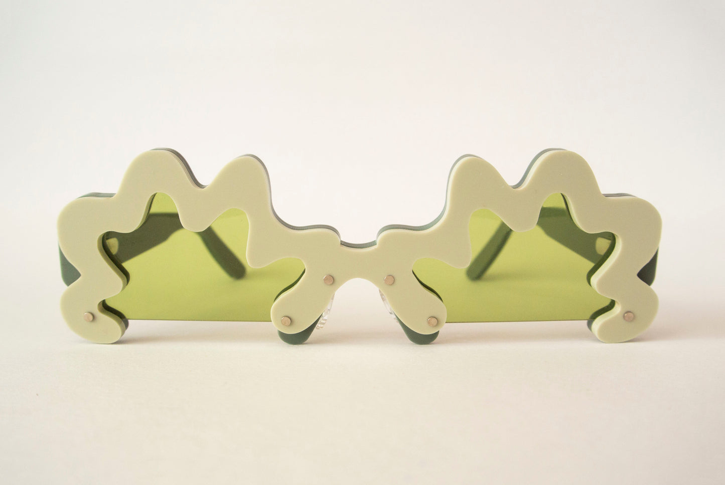 wavy green glasses with green lenses