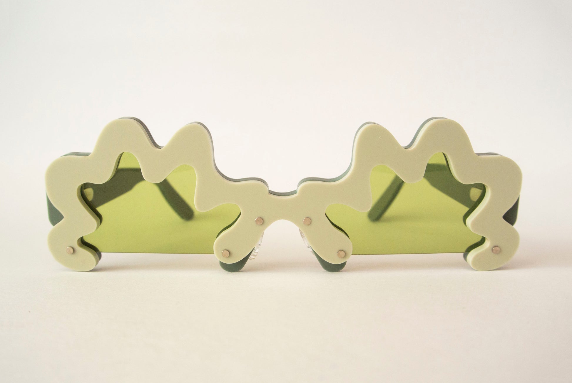 wavy green glasses with green lenses