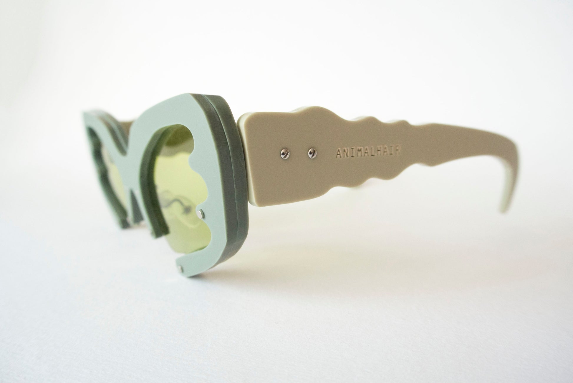 khaki green glasses with sage temples and green lenses