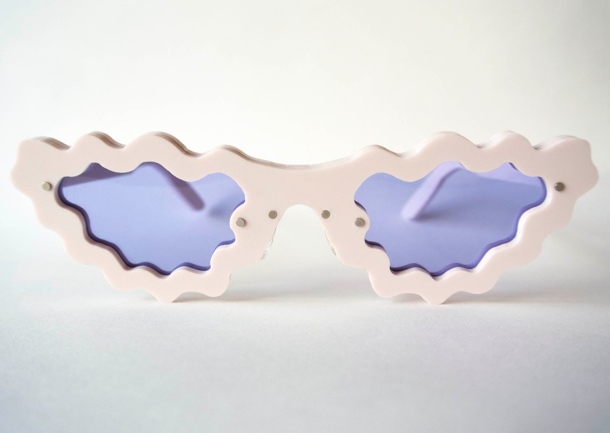 marshmallow frame colour sunglasses with violet lenses and wiggly detail 