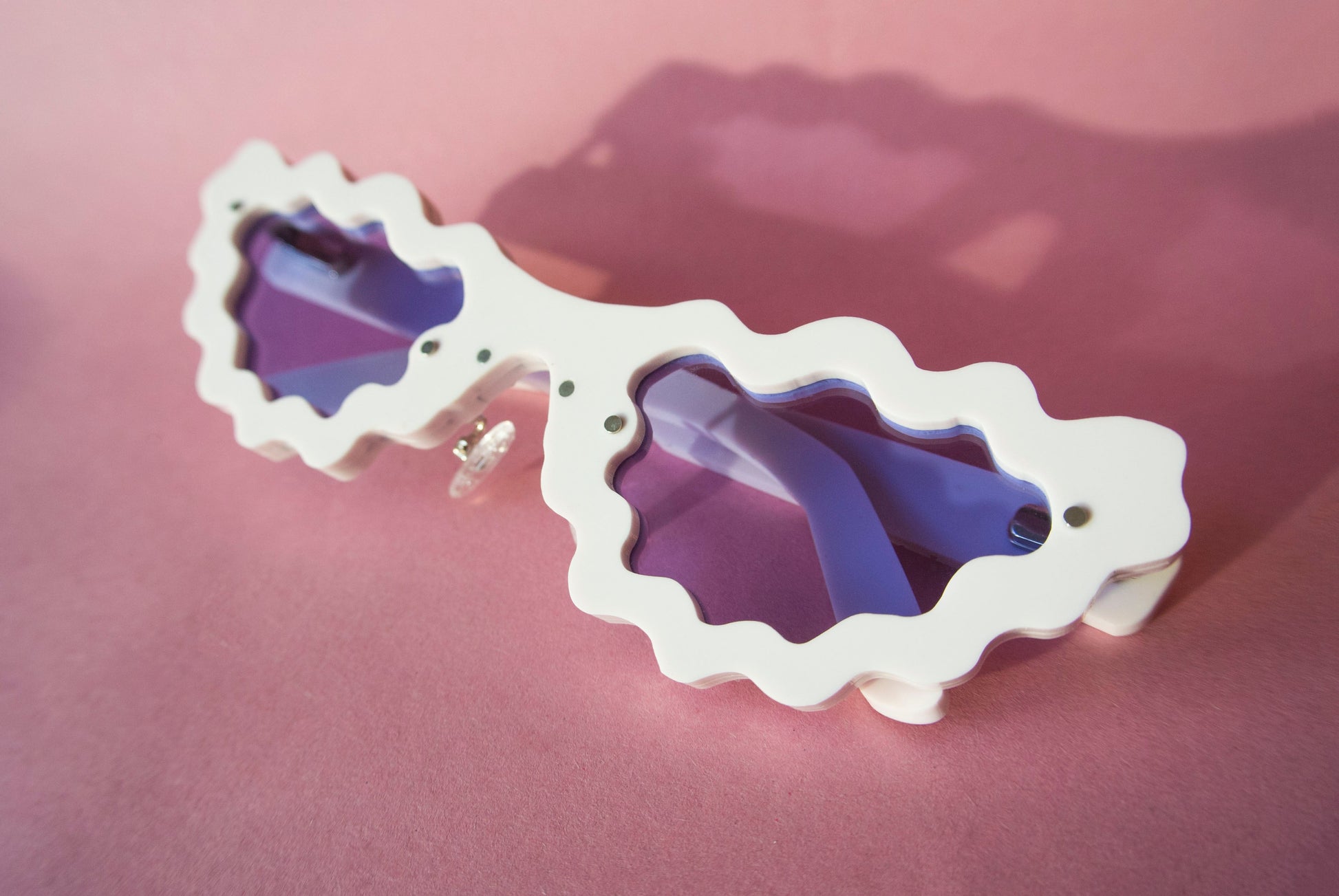 light pink sunglasses with violet lenses