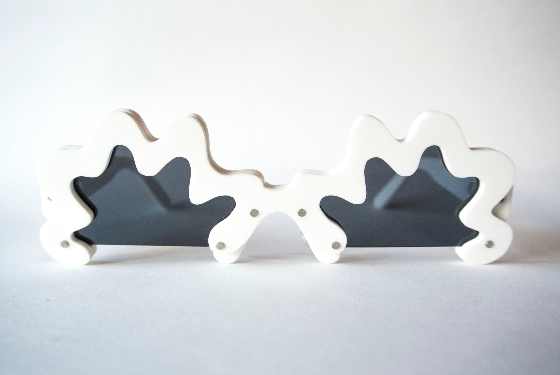 irregular shaped sunglasses by animalhair in white with black lenses