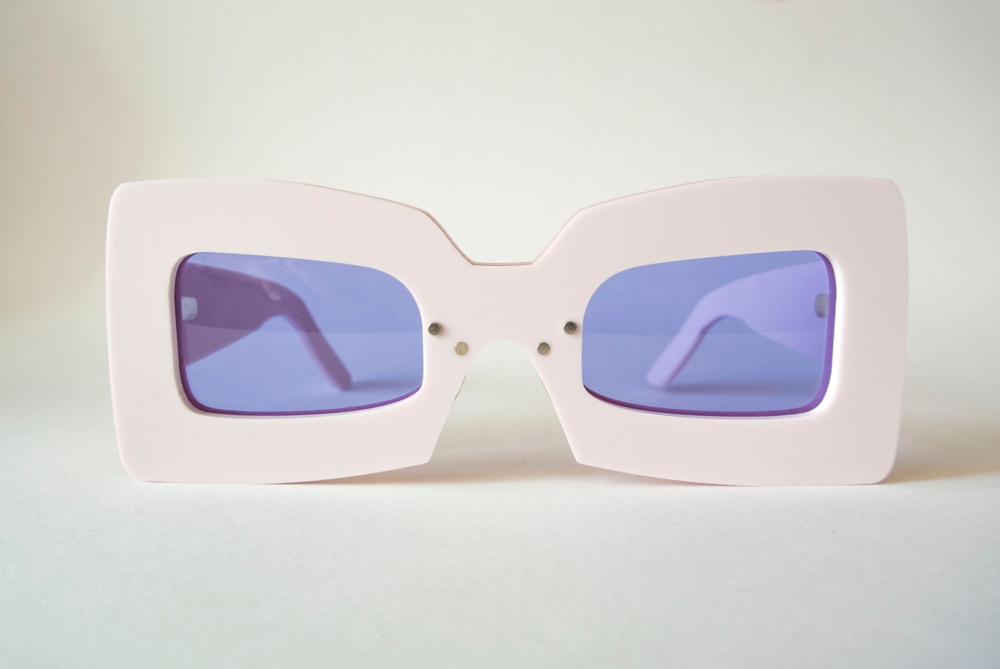 marshmallow pink square shaped glasses with violet lenses