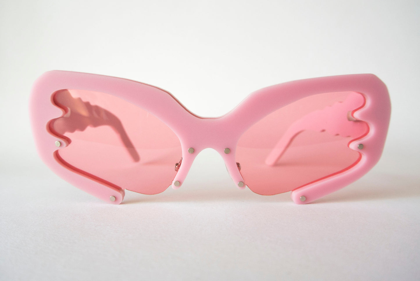 front view of pink 90s glasses with pink lenses by anna mulhearn