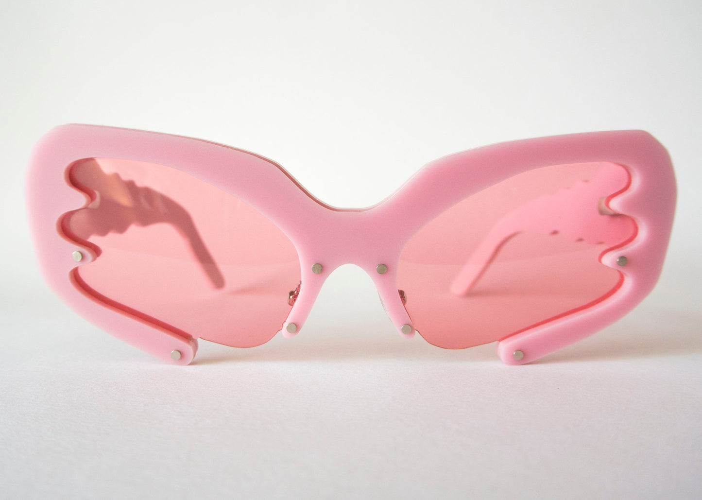 front view of pink 90s glasses with pink lenses by anna mulhearn