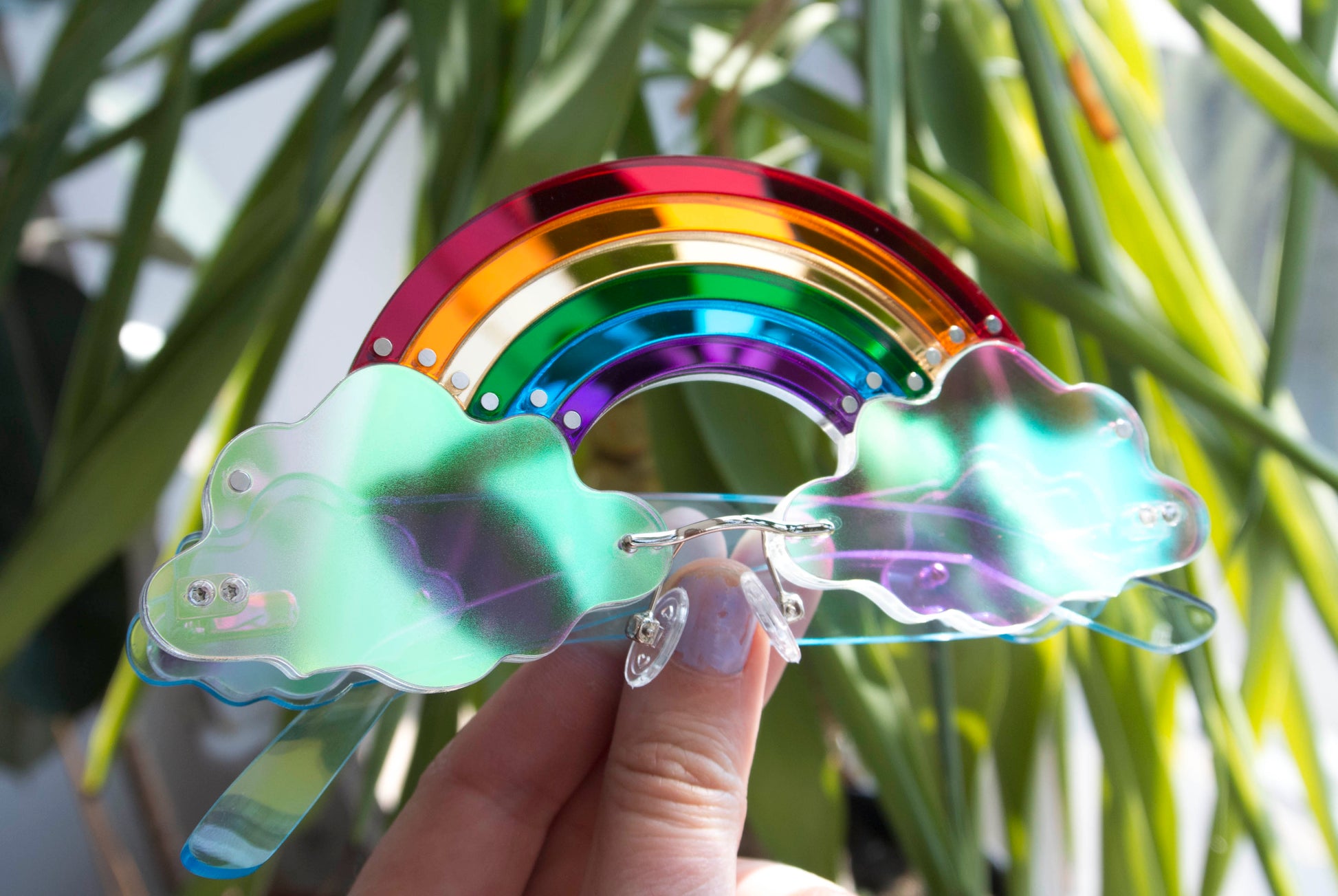 Multi layered bespoke glasses with rainbows and clouds by Anna Mulhearn