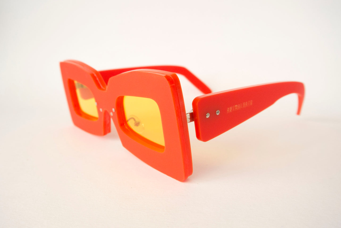 red and yellow lens square shaped glasses