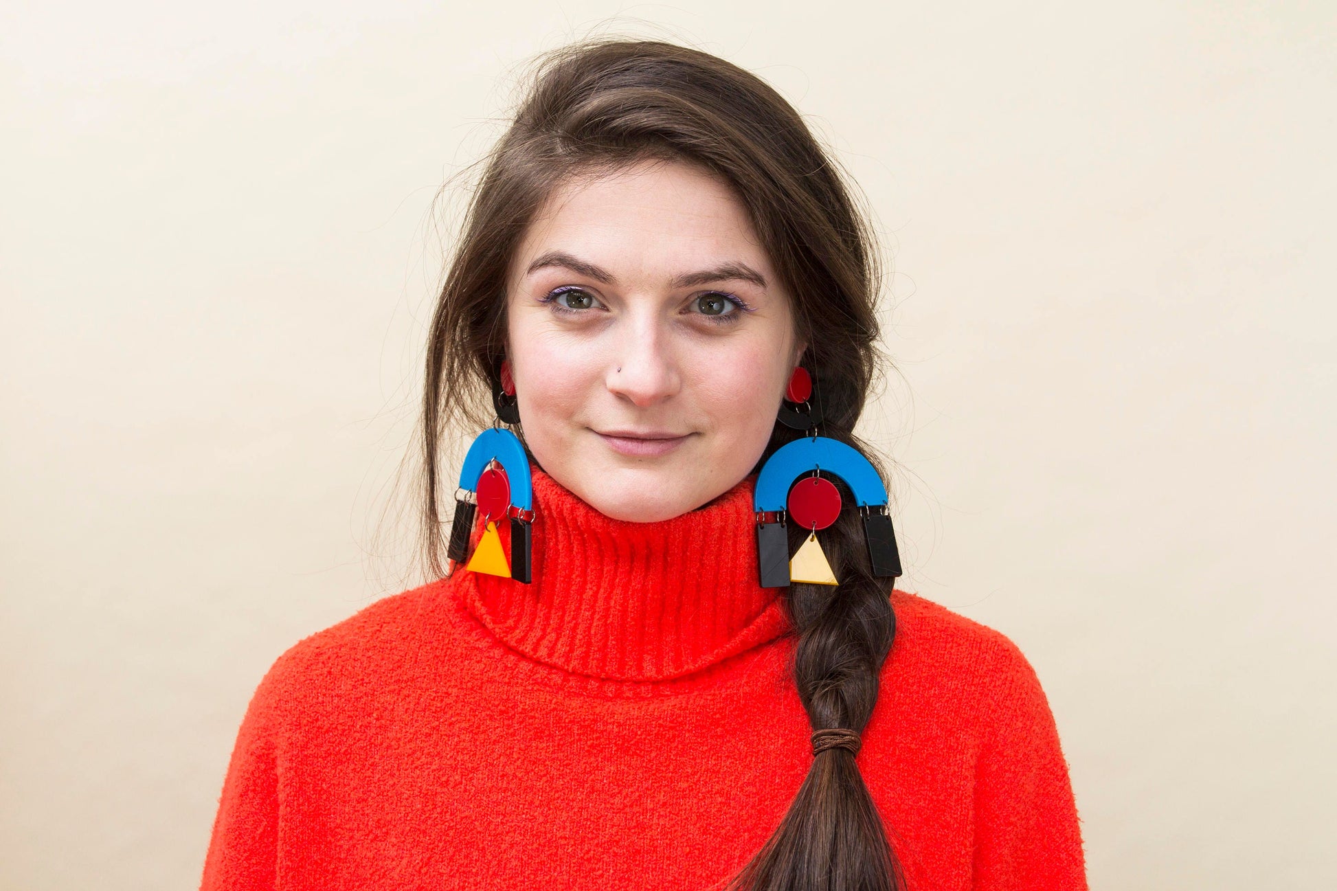 Anna Mulhearn wears building block earrings by animalhair.