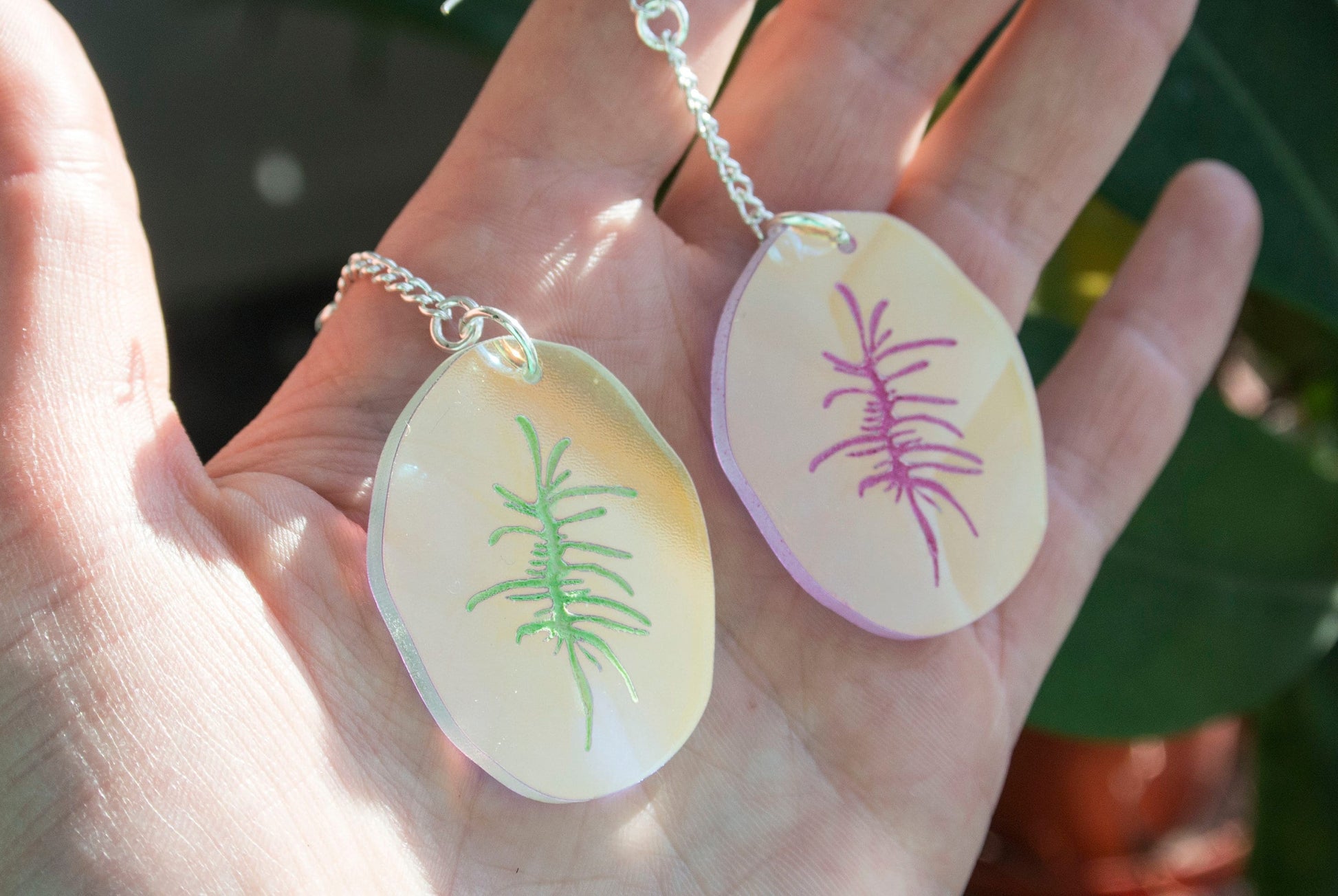 pink and green iridescent bum hole earrings